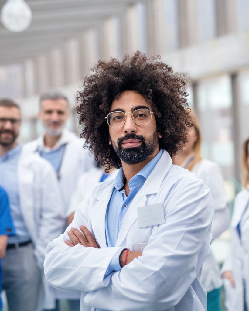 group-of-doctors-standing-in-corridor-on-medical-conference